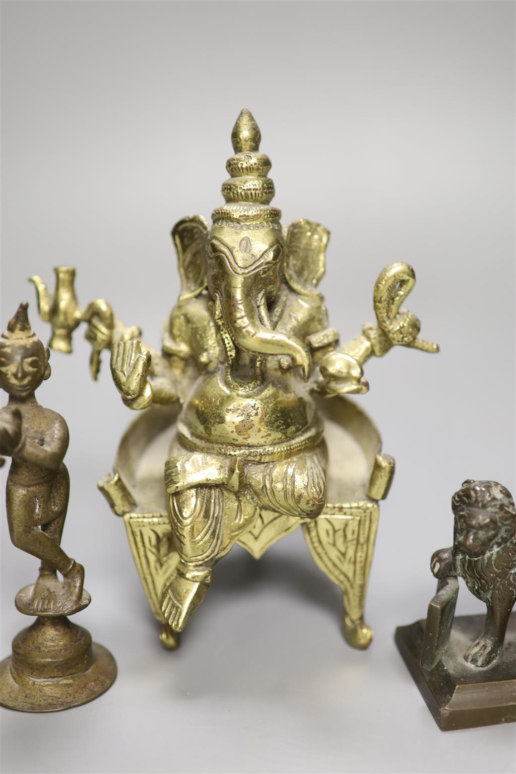 An Indian bronze figure of Ganesh, a bronze of a dancer and a bronze of the Lion of Venice, tallest 18cm